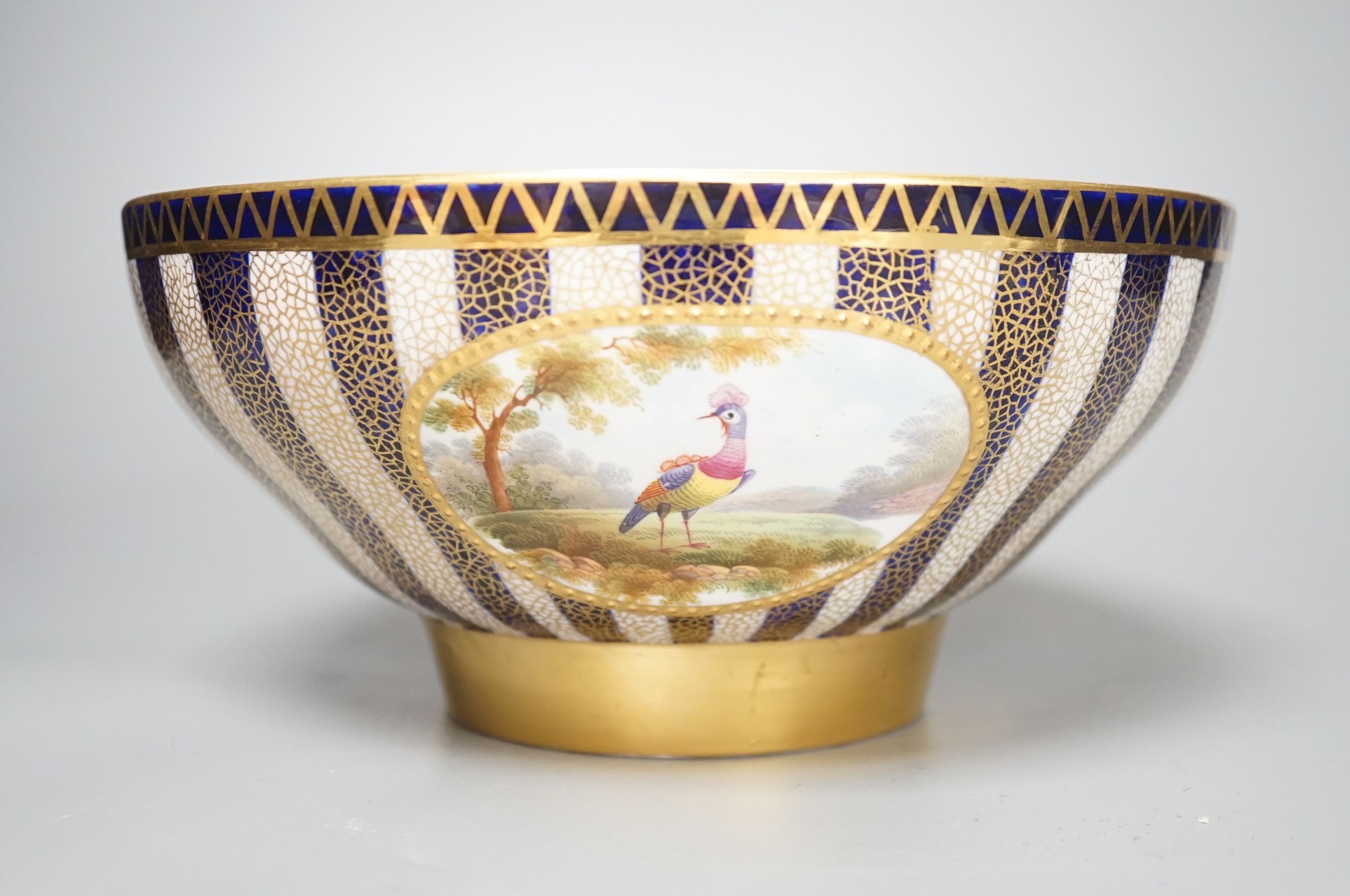 An Aynsley fine bowl with three interior landscape panels and three exterior panels painted with birds between alternating blue and white gilt stripes four panels signed R.J.K. for Richard J. Keeling, c.1910, height 10.5